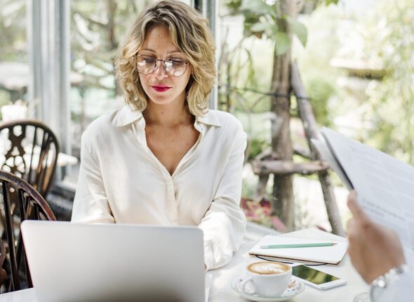 businesswoman-using-laptop-in-the-cafe-2022-09-16-07-36-10-utc-2048x1550